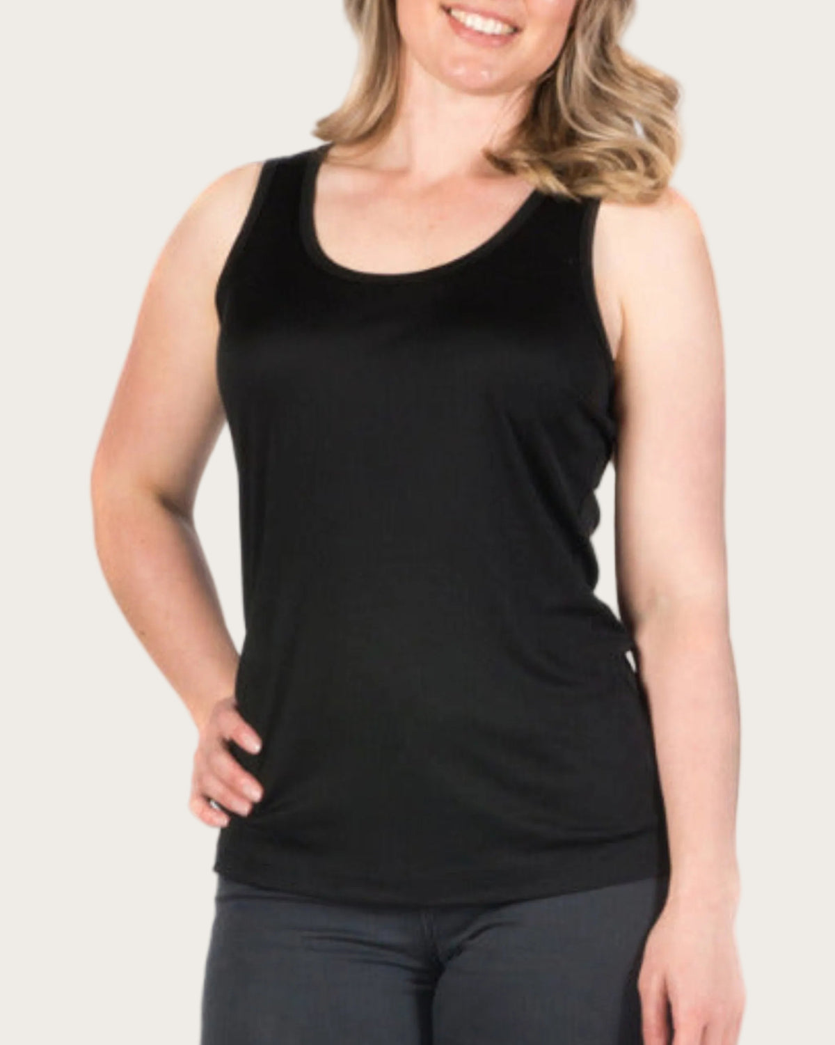 Woman wearing a silk classic Tank Top black sleeveless top