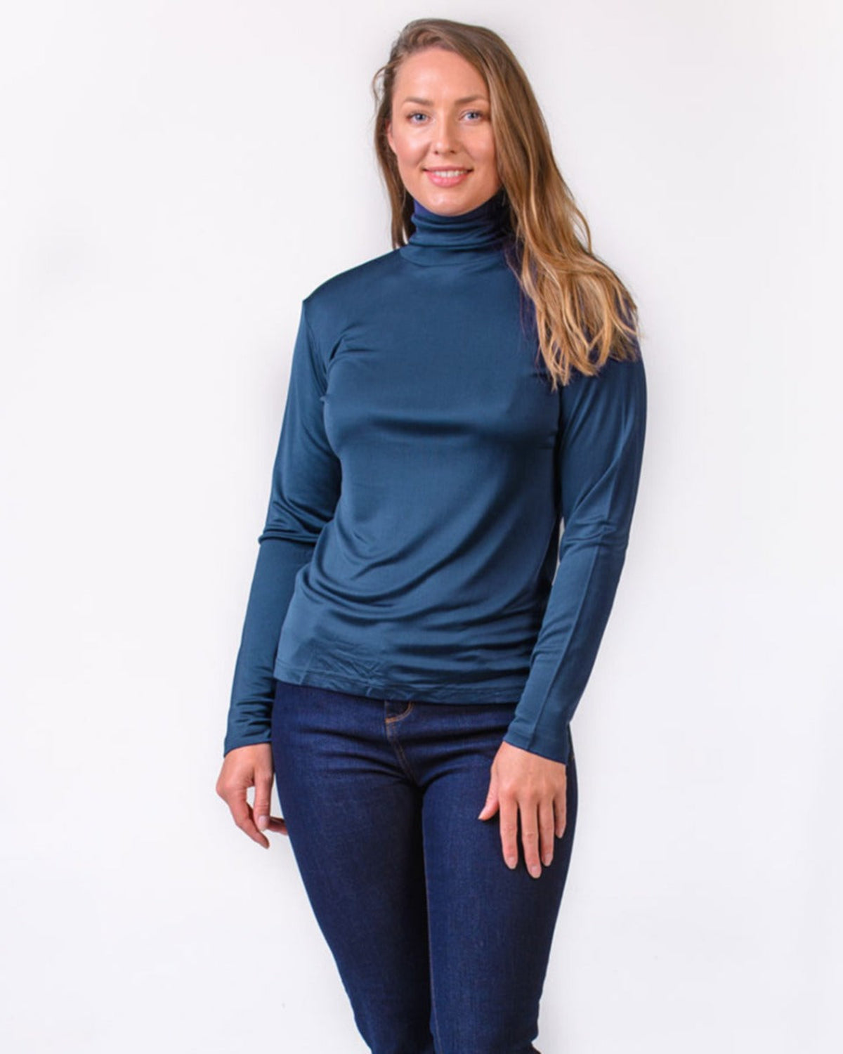 Woman wearing a silk  blue turtleneck 
