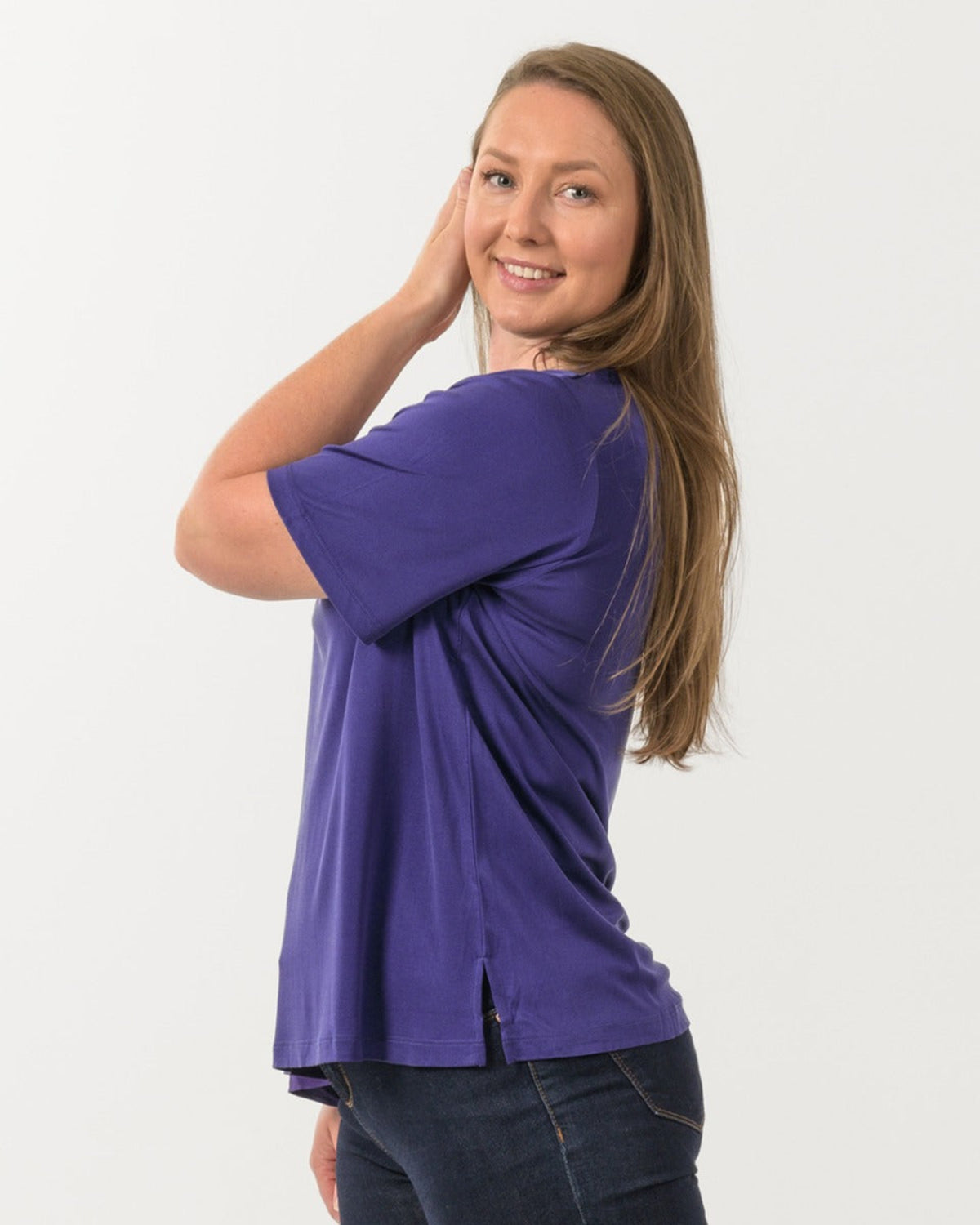 Woman wearing a silk purple shirt 
