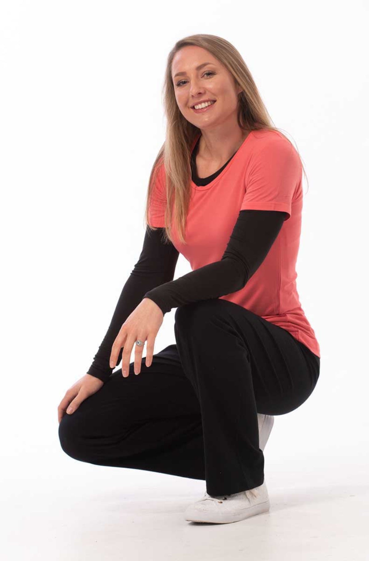 Bamboo leisure Woman in a red top and black pants posing on a white background