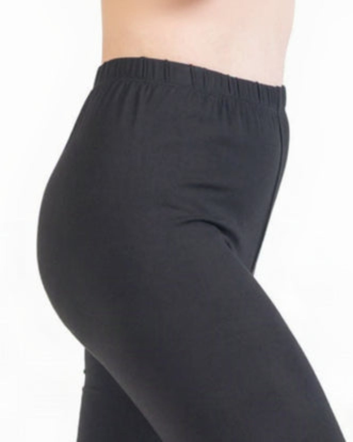 Black leggings worn by a person on a white background