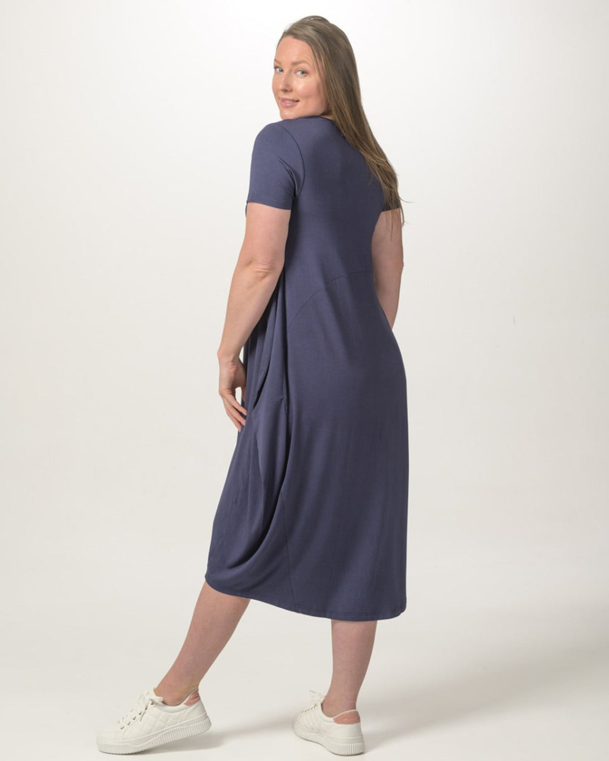 Woman bamboo cocoon wearing a navy blue dress on a white background