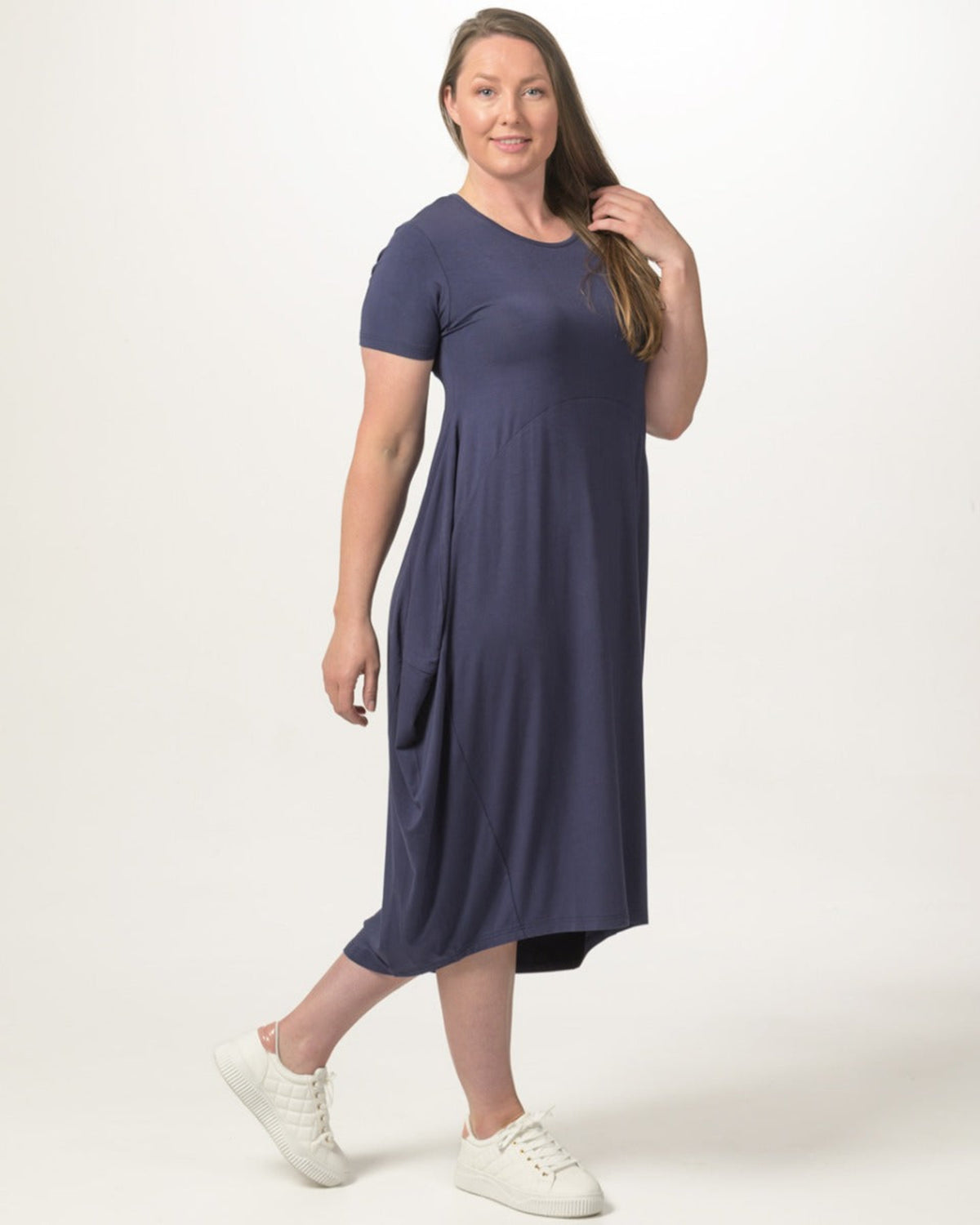 Woman bamboo cocoon  wearing a purple dress on a white background