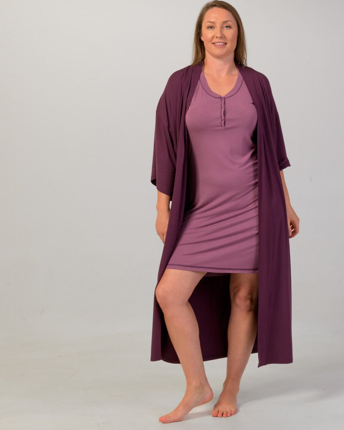 Bamboo kimono roe Woman wearing a purple dress and matching robe on a plain background