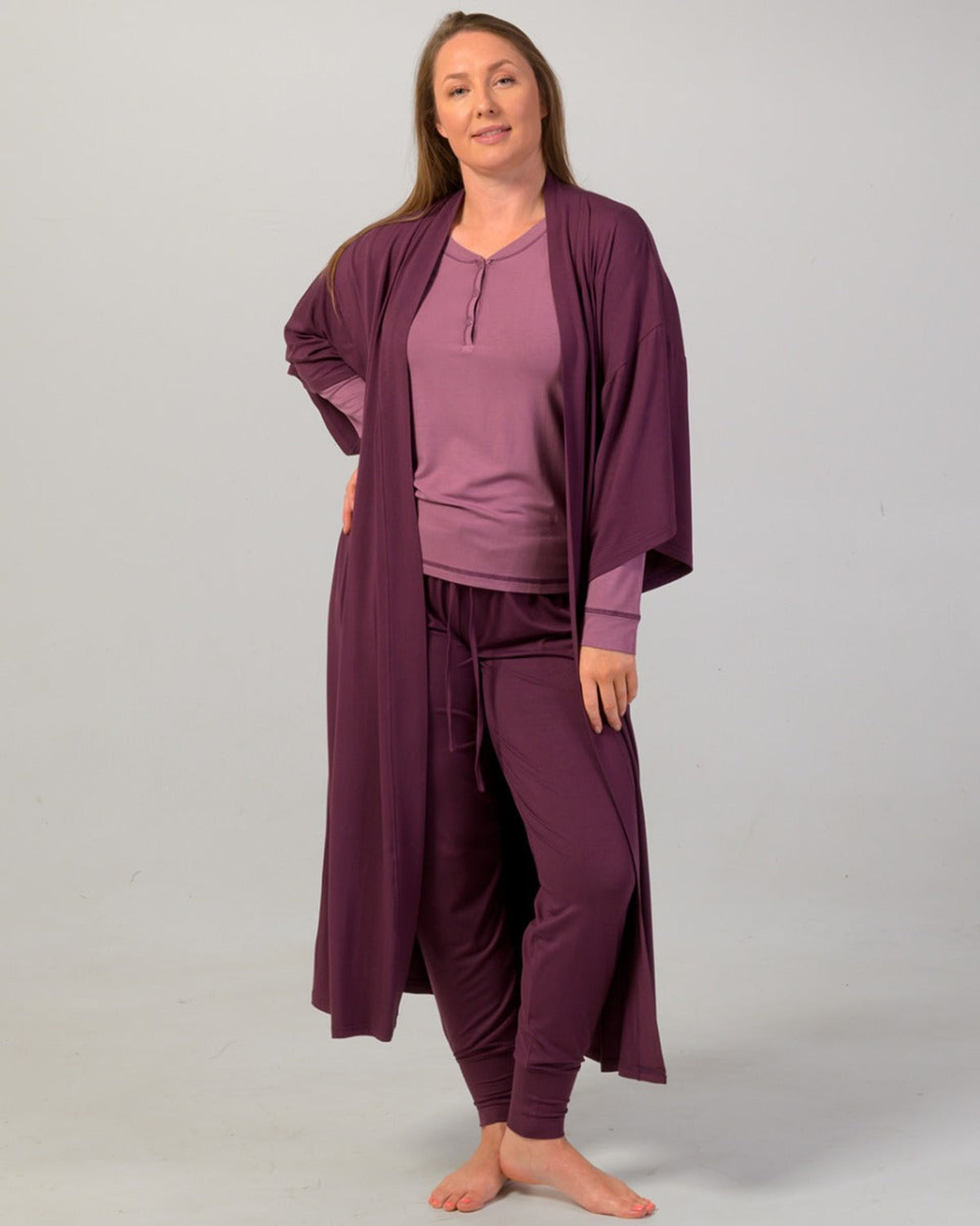 Woman wearing a eggplant pajama cuffed pants