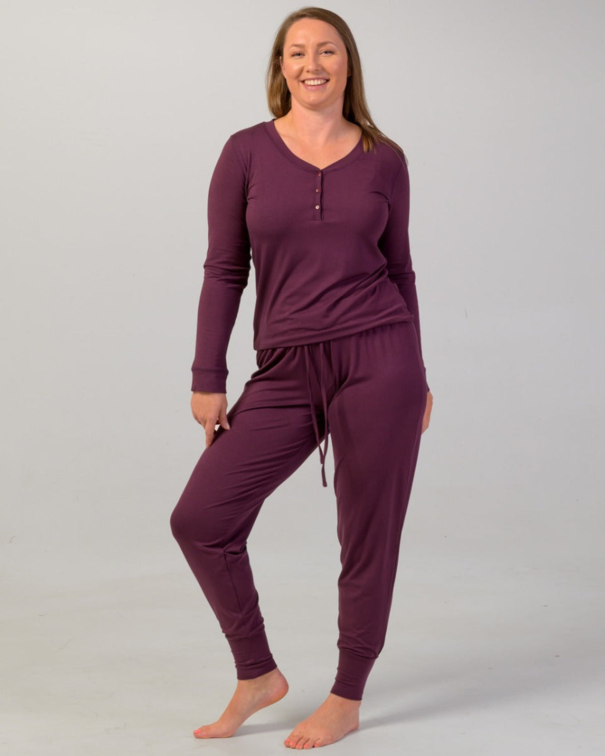 Woman wearing a eggplant pajama cuffed pants