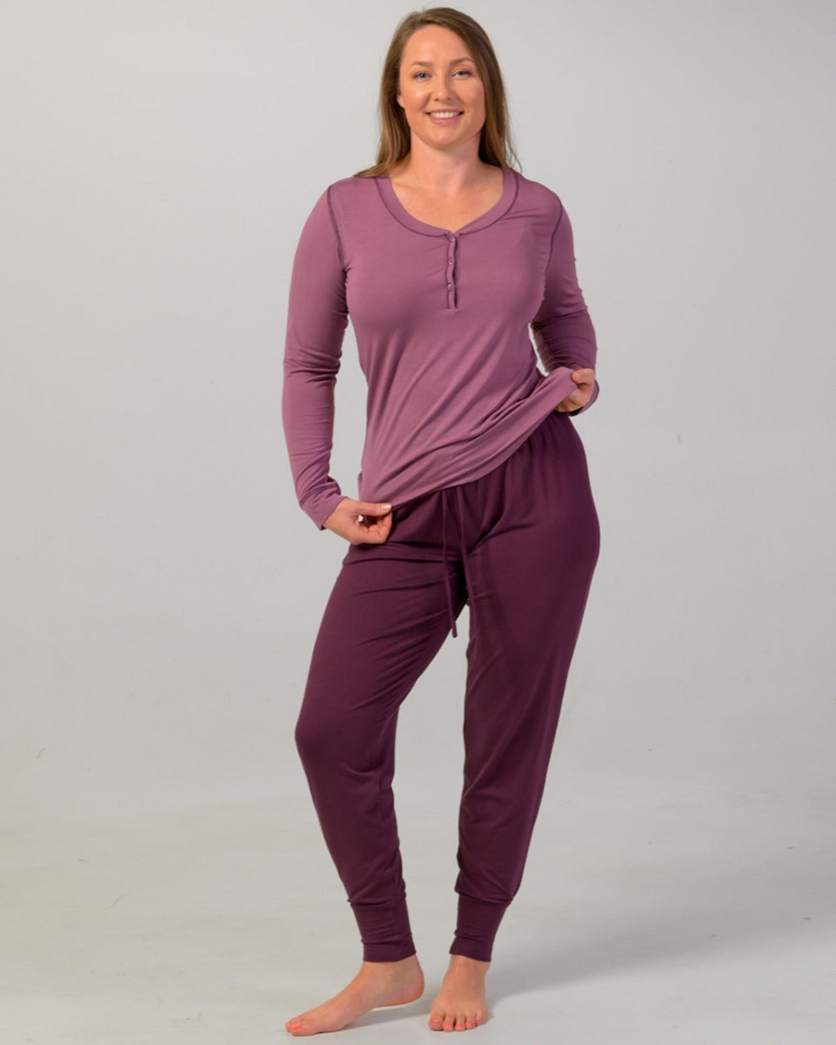 Woman wearing a eggplant pajama cuffed pants
