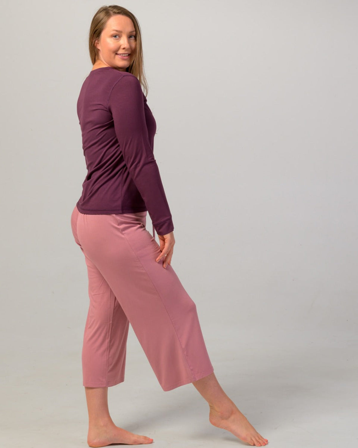 Woman wearing a eggplant  long-sleeve pajama top bamboo