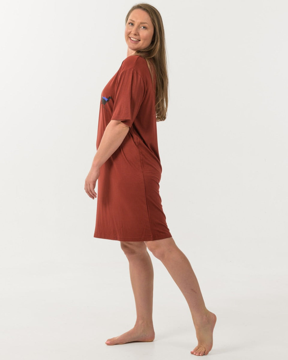 Bamboo Woman wearing a rust-colored dress on a white background