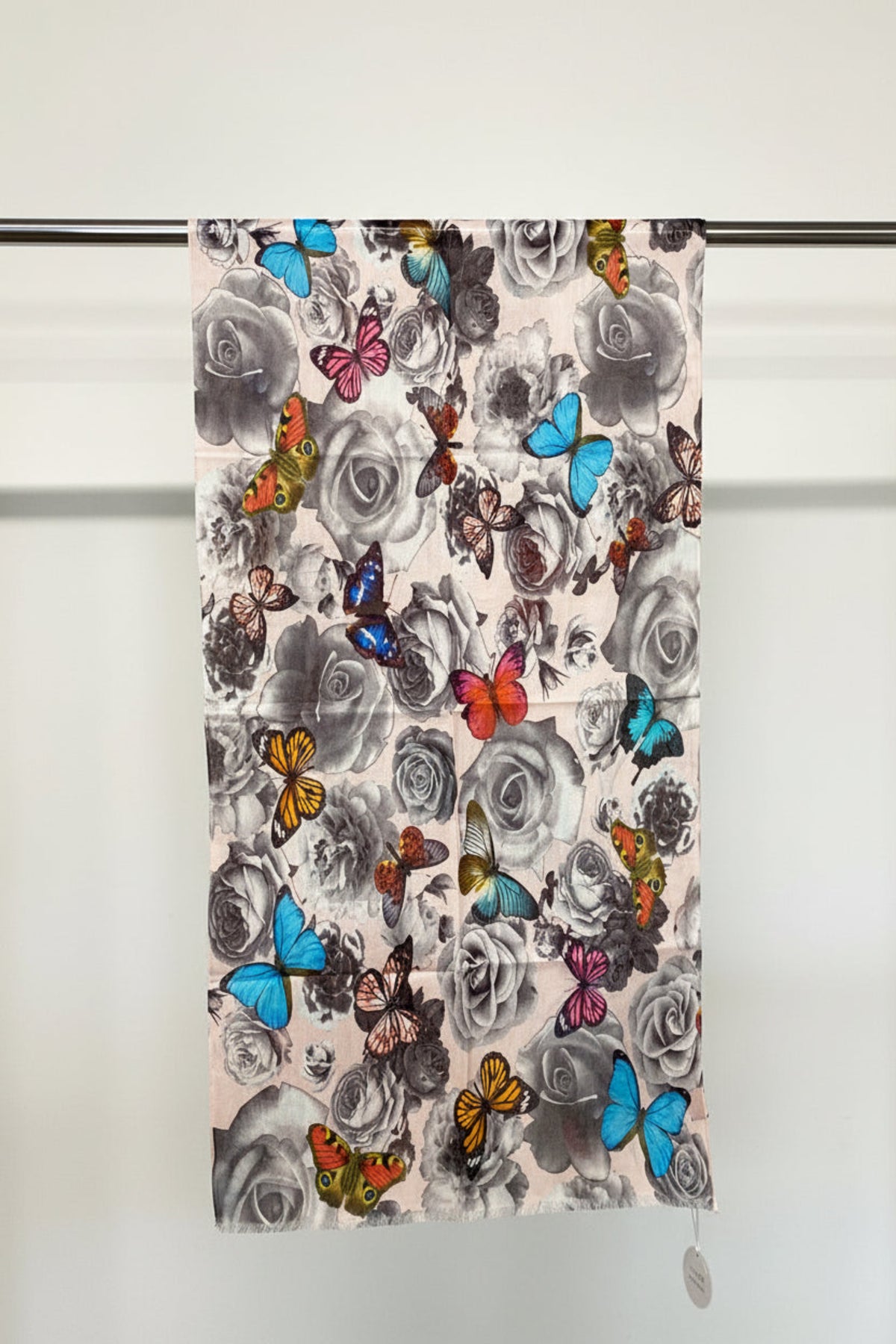 Scarf with floral and butterfly pattern on a white background