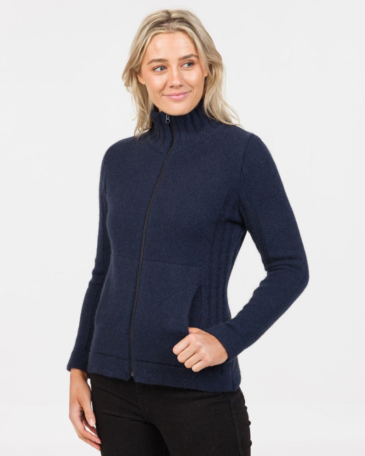 Woman possum merino wearing a navy blue zip-up sweater on a white background