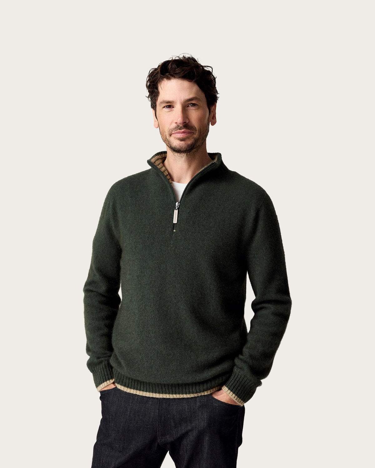Men's dark green possum merino half zip sweater with contrast inner collar.