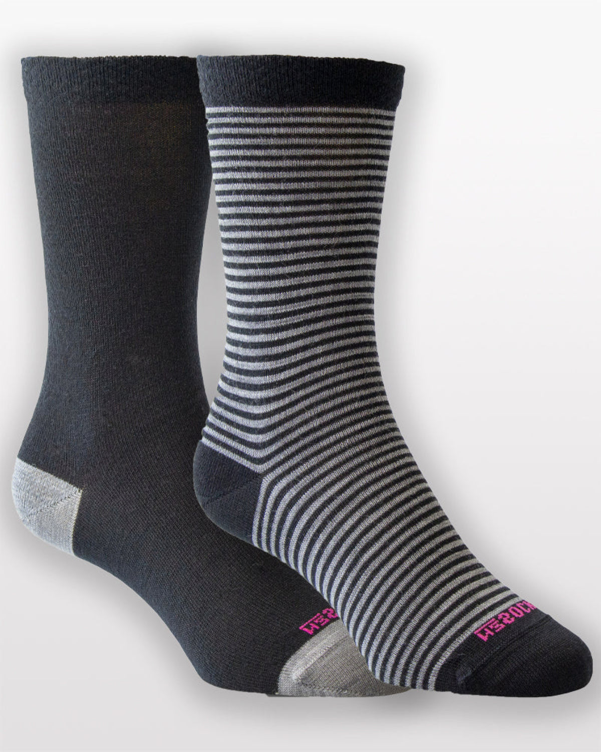 Two pairs of merino socks, one black and gray striped, the other solid black, on a white background.