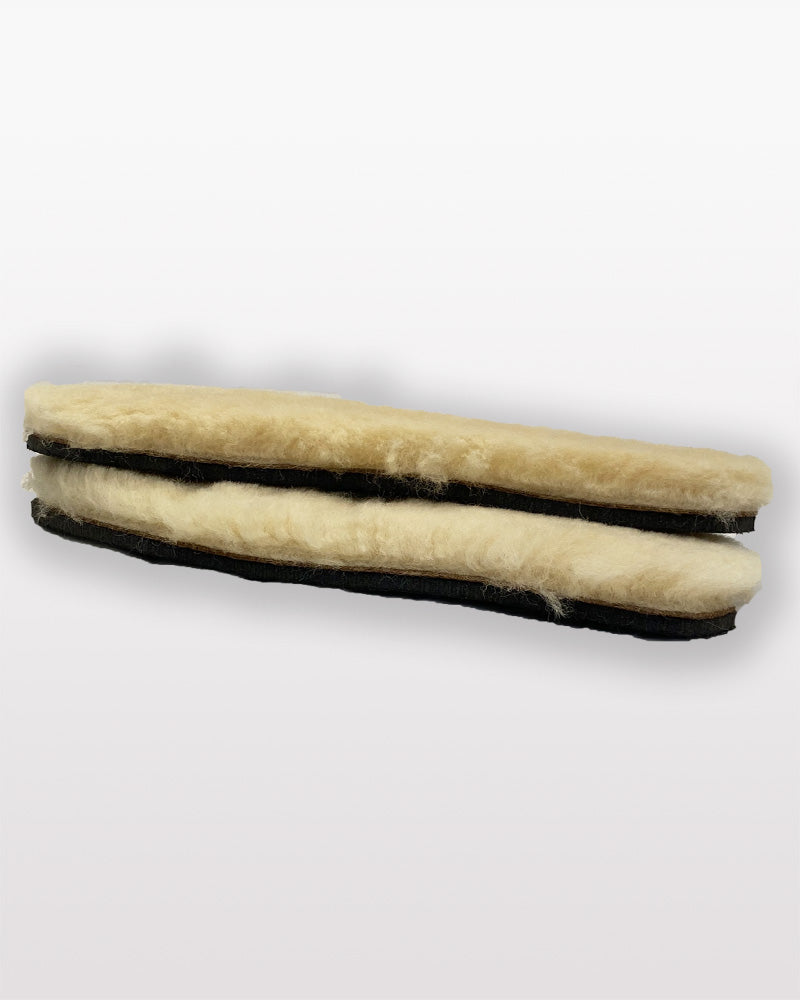 Two cylindrical filters with beige material and black edges on a white background