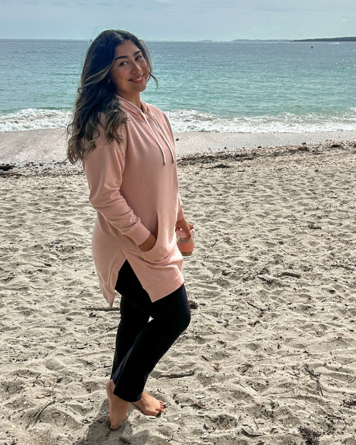 Woman in a pink long-sleeve hoodie