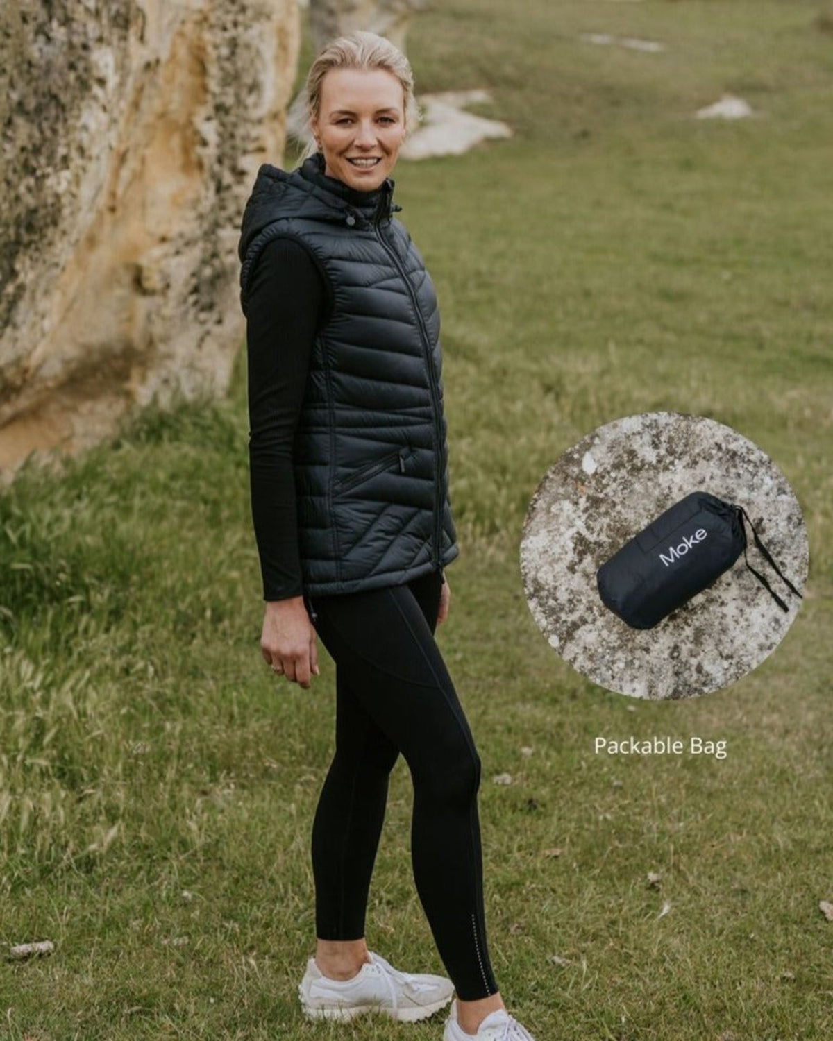 Woman black puffer vest
