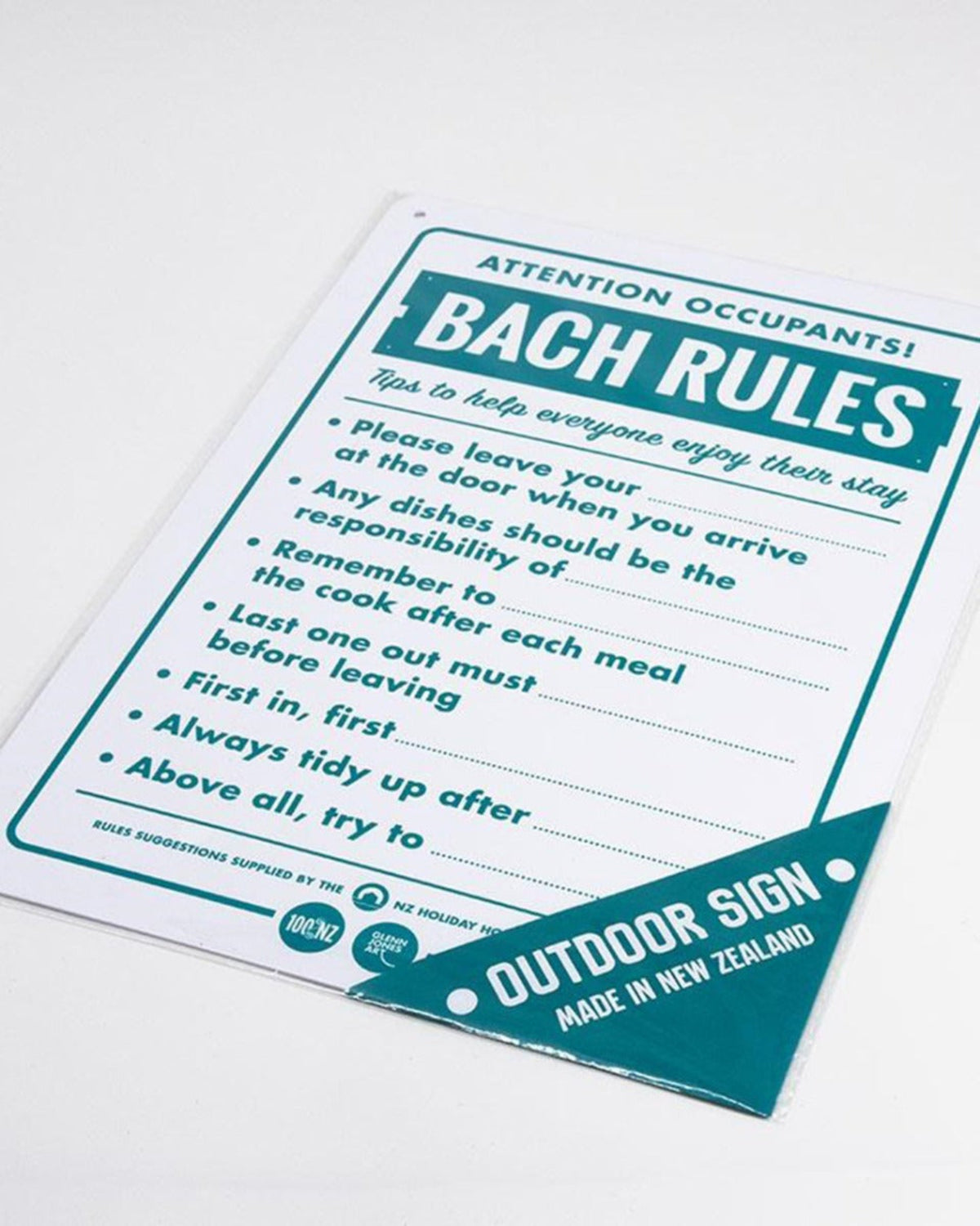 Sheet of paper with 'Bach Rules' printed on it, featuring a list of rules for shared living spaces.