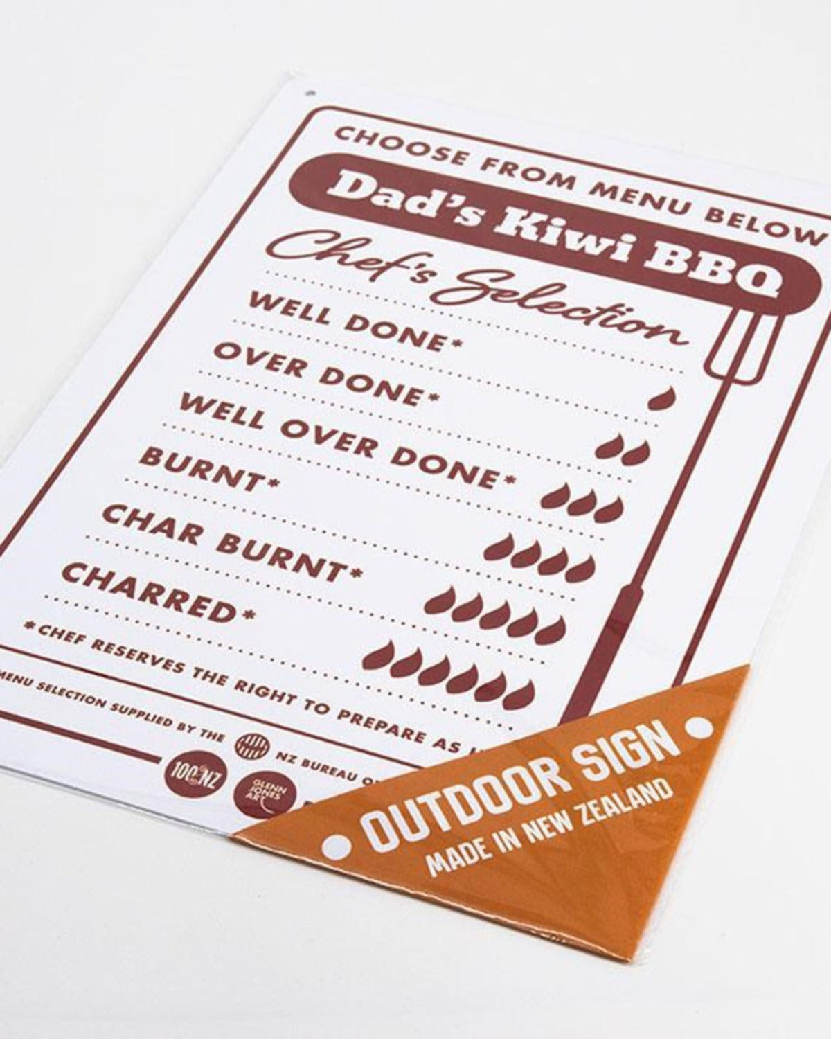 Menu for Dad's Kiwi BBQ with grill quality grading system and outdoor sign.