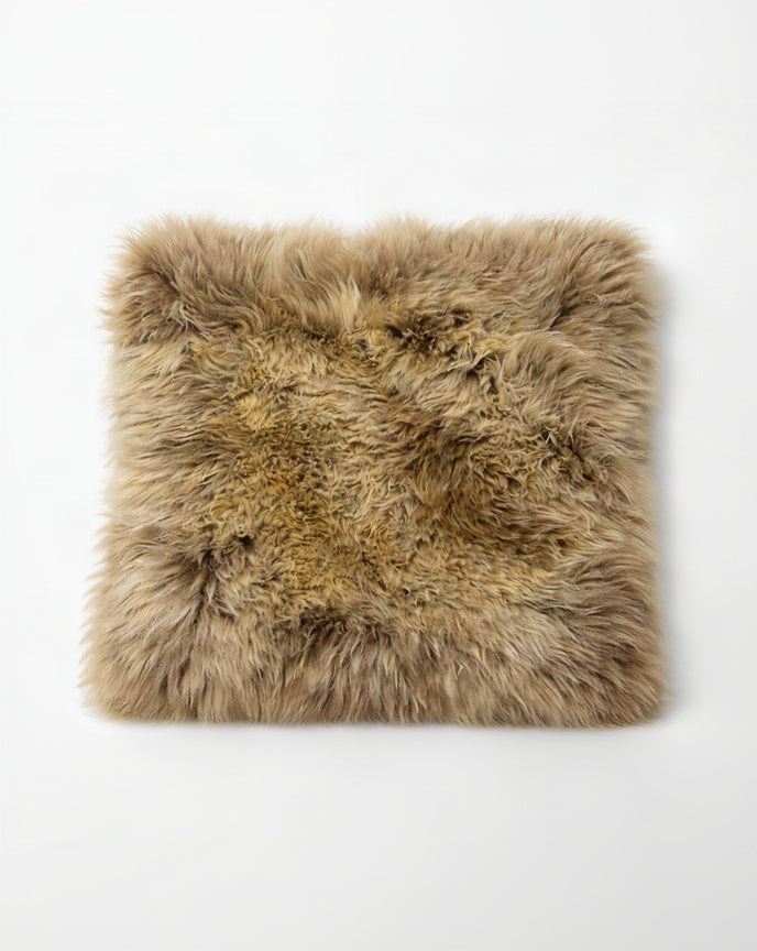 Brown fur pillow on a white background