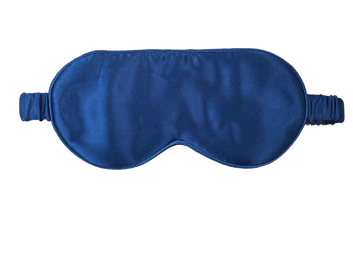 Blue silk satin sleep mask on a white background
