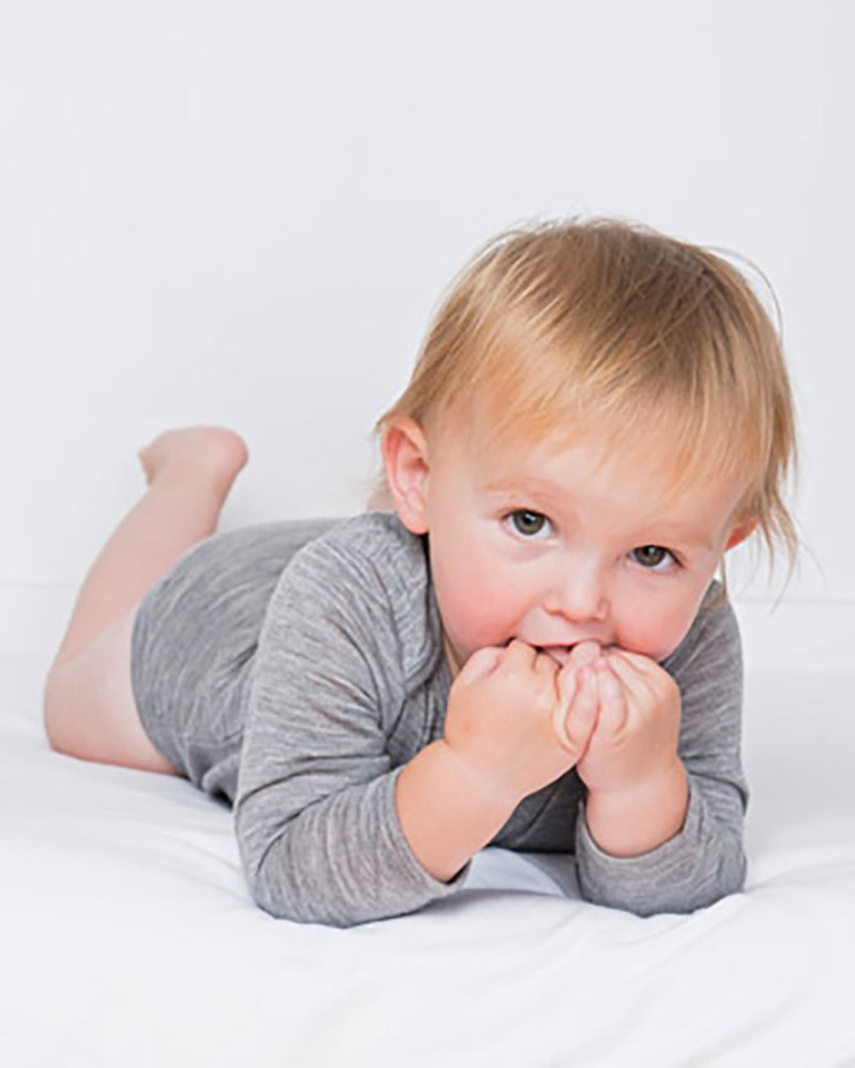 Baby in a gray merino outfit