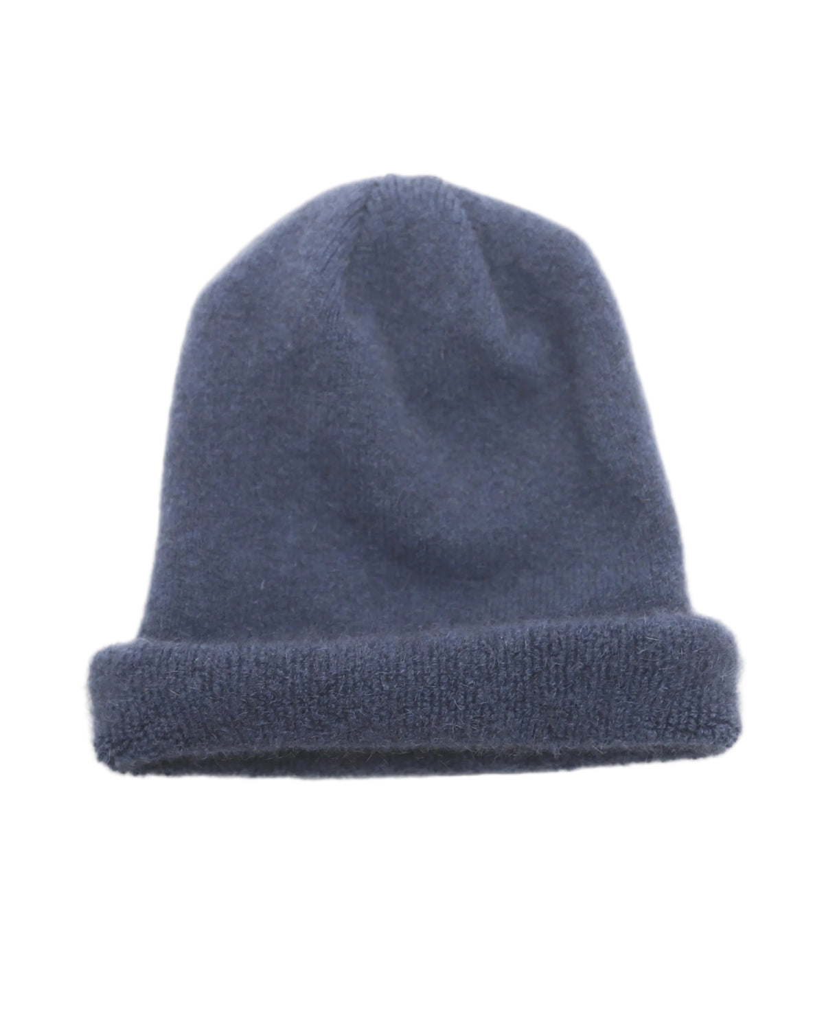 possum merino
Blue knit beanie on a light beige background
