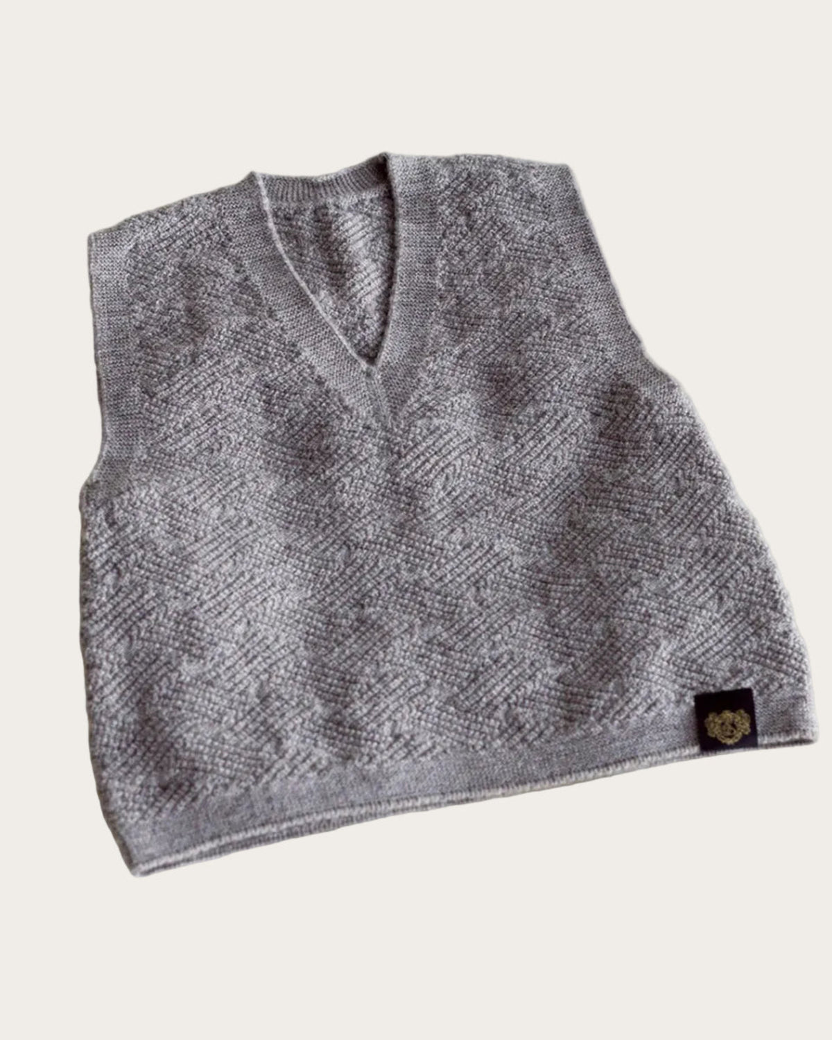 Gray knitted baby merino vest