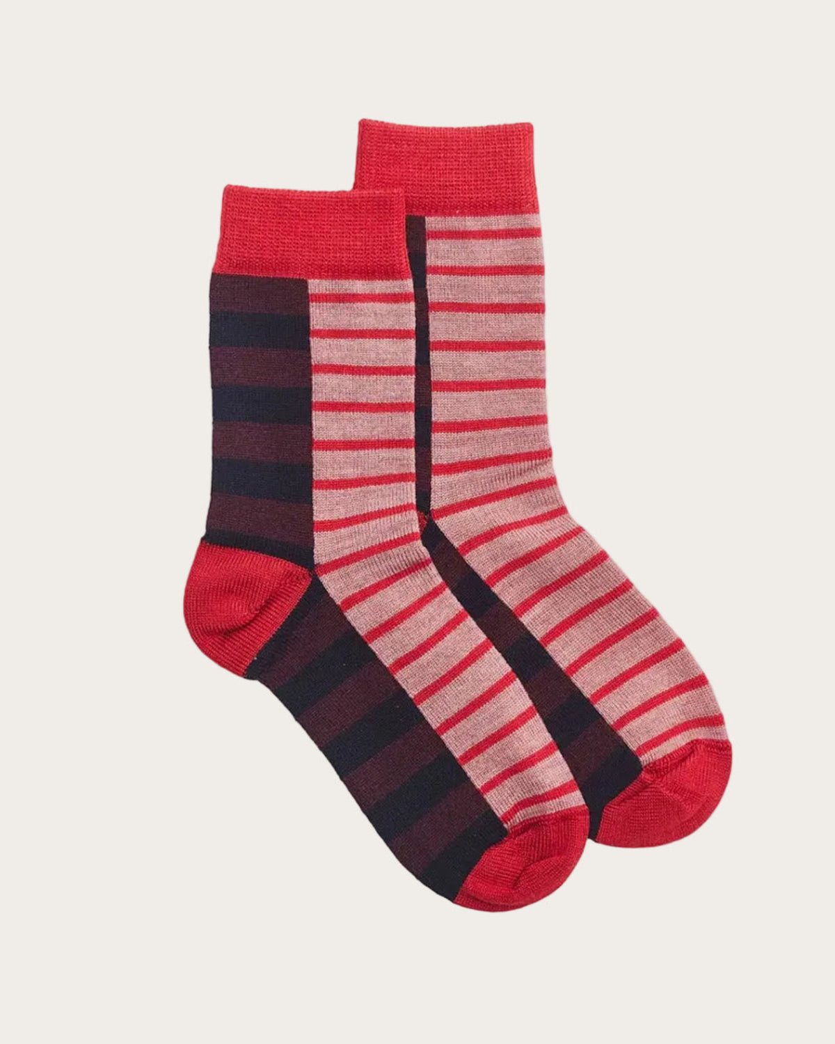One pair of red and black merino striped socks on a white background