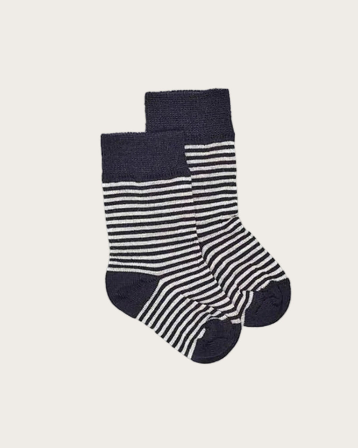 Pair of merino striped socks with navy and white pattern on a white background