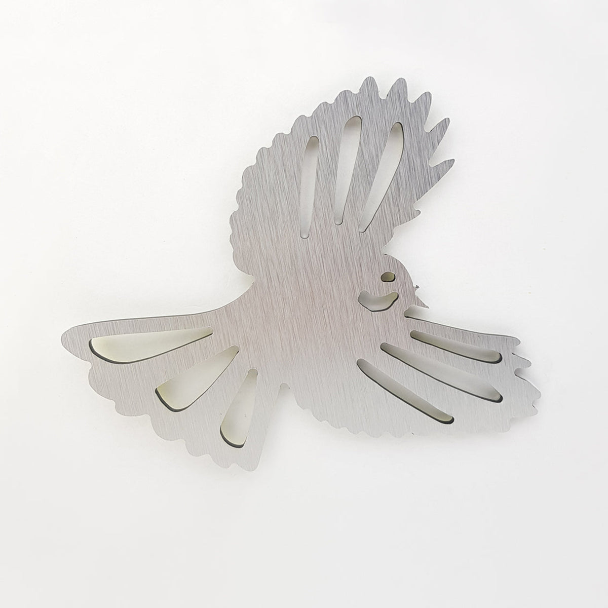 silver fantail Decorative wall sculpture of a bird in flight on a white background