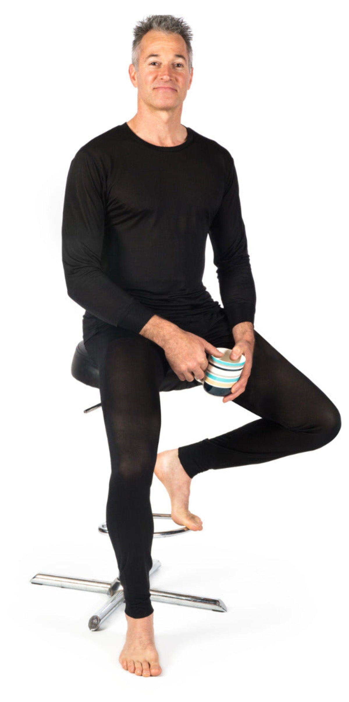 Man wearing black long-sleeve shirt and silk thermal  leggings 