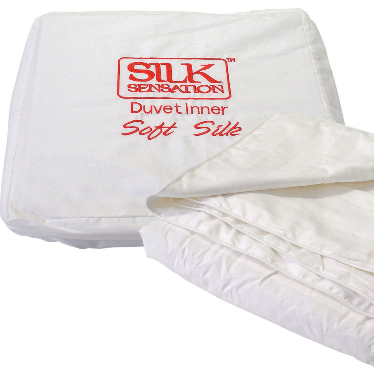 Folded white silk duvet inner with 'Silk Sensation' branding on a white background