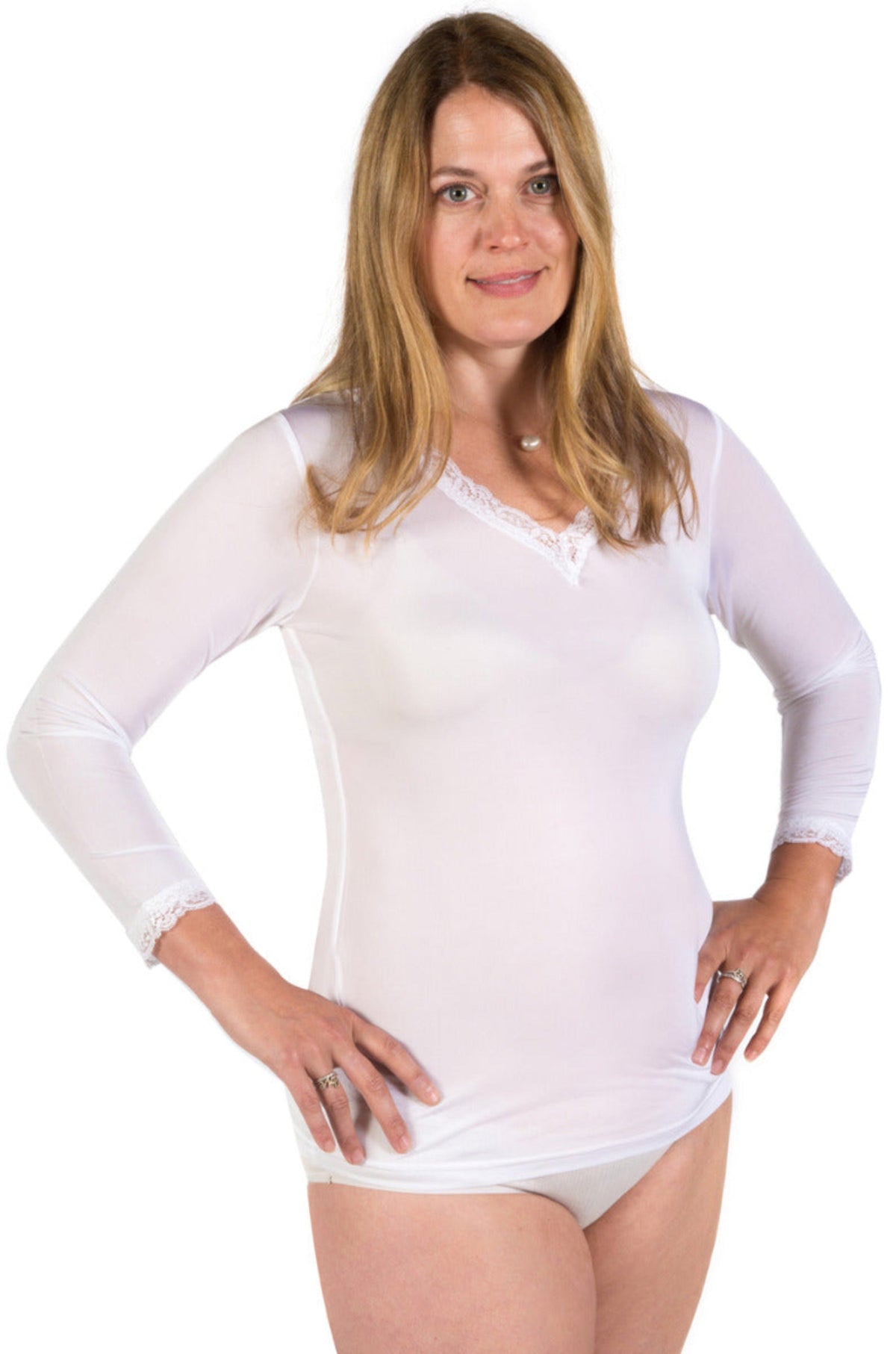 Woman wearing a silk white long-sleeve top on a white background