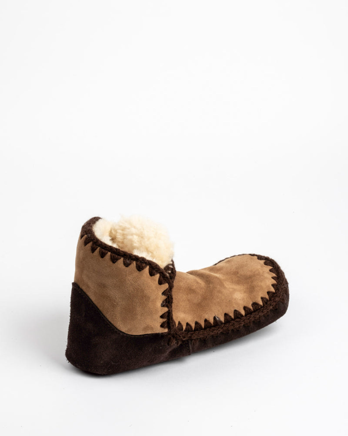 Brown and beige slipper on a white background