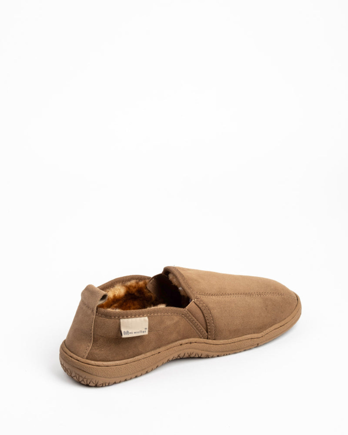 Brown Sheepskin slip-on shoe with fur lining on a white background