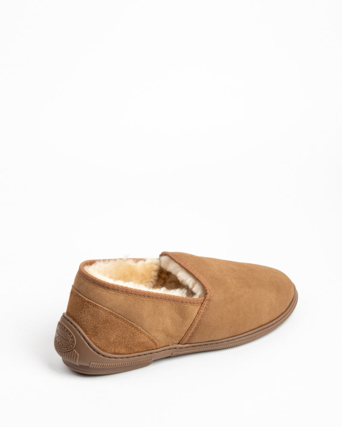 Brown sheepskin slipper with shearling lining on a white background