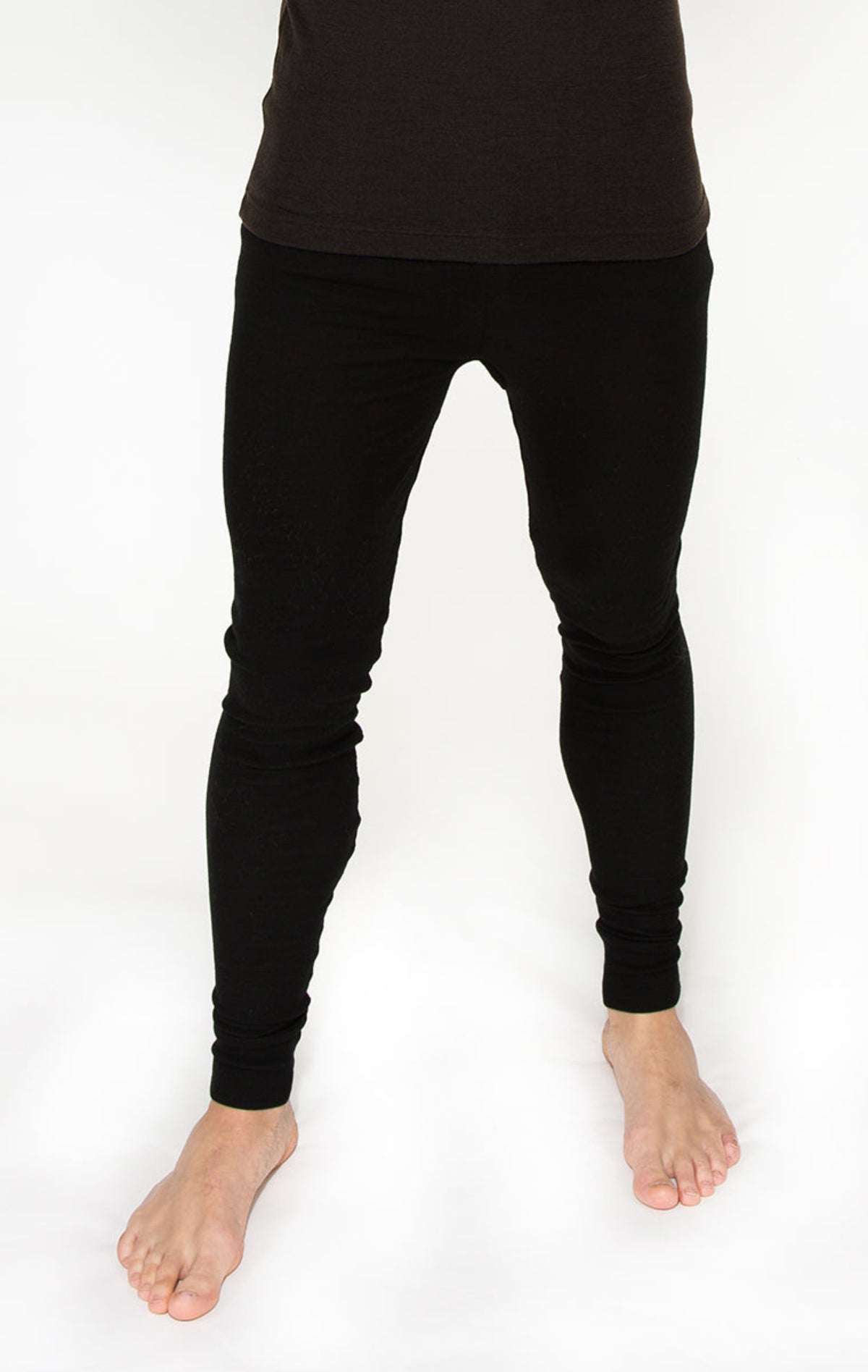 merino Person wearing black leggings on a white background