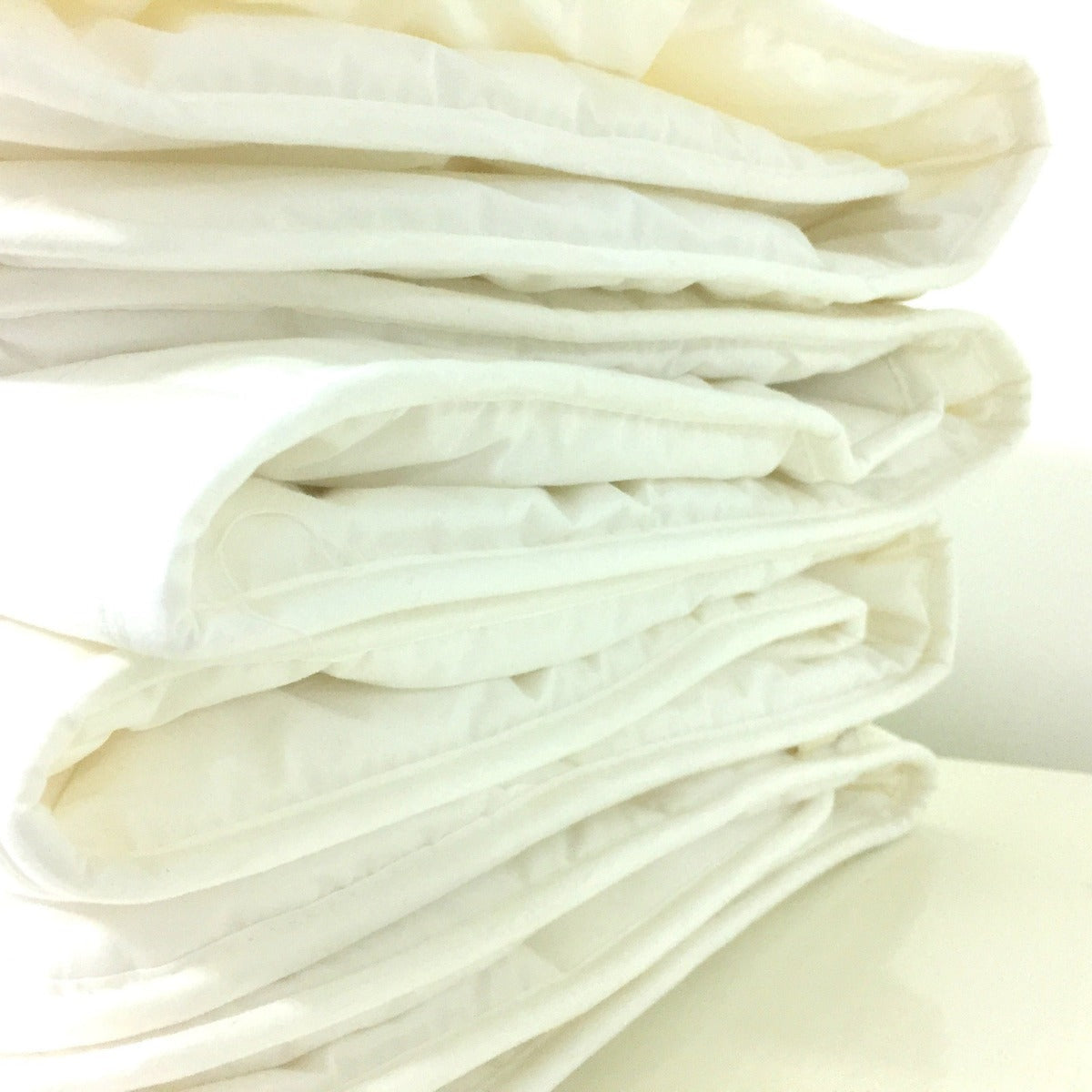 Close-up of white wool on a light background